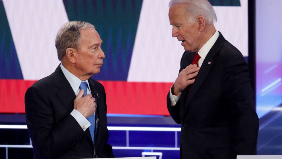 PHOTO: Democratic presidential candidates, former New York City Mayor Mike Bloomberg, left, and former Vice President Joe Biden talk during a break in a Democratic presidential primary debate, Feb. 19, 2020, in Las Vegas, hosted by NBC News and MSNBC.