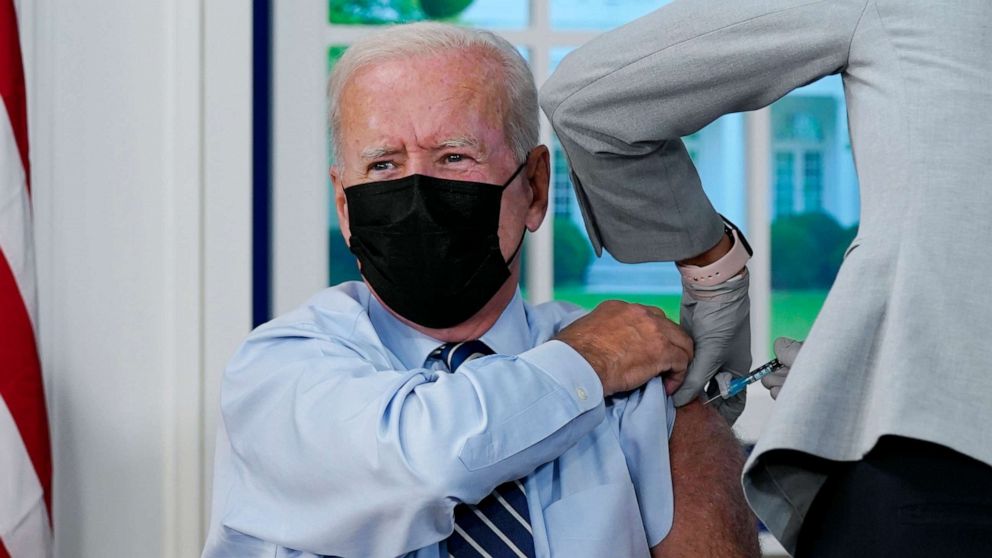 PHOTO: President Joe Biden receives a COVID-19 booster shot during an event in the South Court Auditorium on the White House campus, Sept. 27, 2021, in Washington.