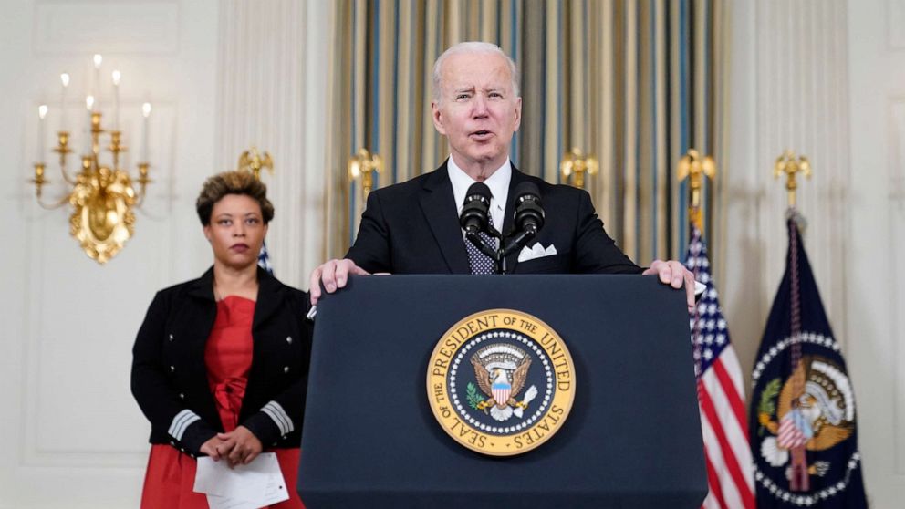 PHOTO: President Joe Biden speaks about his proposed budget for fiscal year 2023 in the State Dining Room of the White House, Monday, March 28, 2022, in Washington, D.C., as Office of Management and Budget acting director Shalanda Young listens.