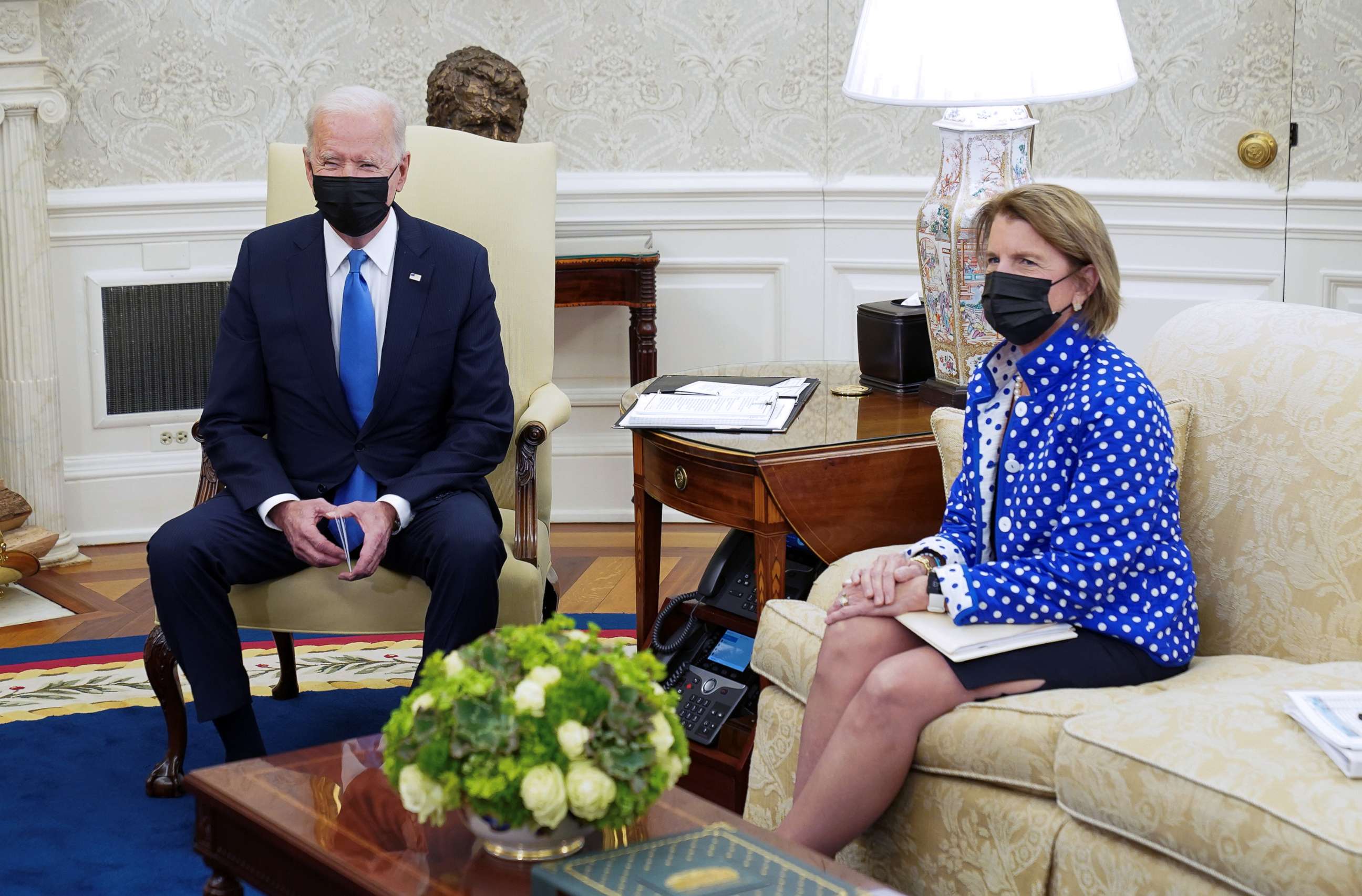 PHOTO: President Joe Biden and Senator Shelley Capito sit in the Oval Office during an infrastructure meeting at the White House, May 13, 2021.