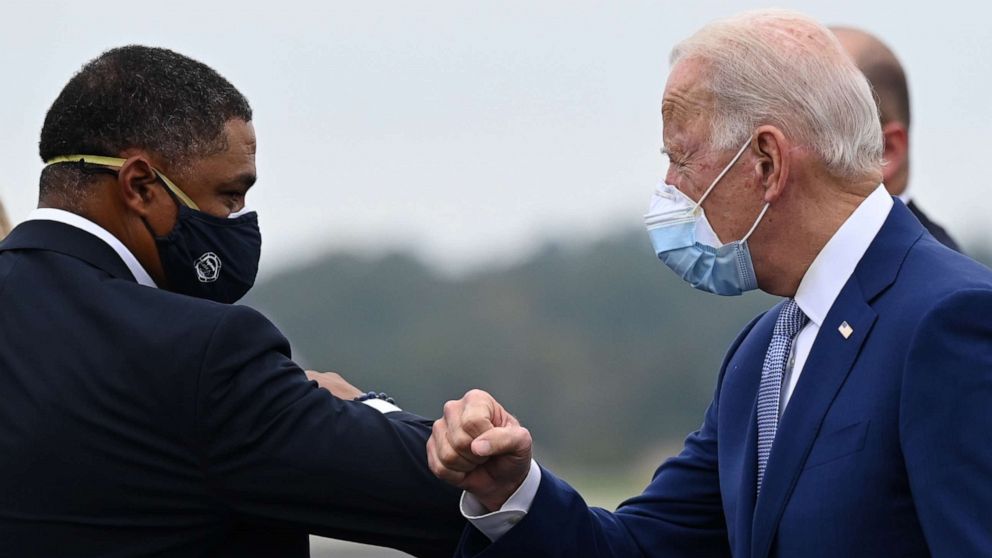 PHOTO: Democratic presidential candidate Joe Biden is greeted by Congressman Cedric Richmond as he arrives in Columbus, Ga., on Oct. 27, 2020.