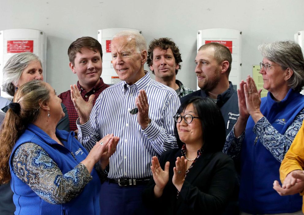 PHOTO: Joe Biden, center, is applauded as he speaks during a tour at the Plymouth Area Renewable Energy Initiative on June 4, 2019, in Plymouth, N.H. 