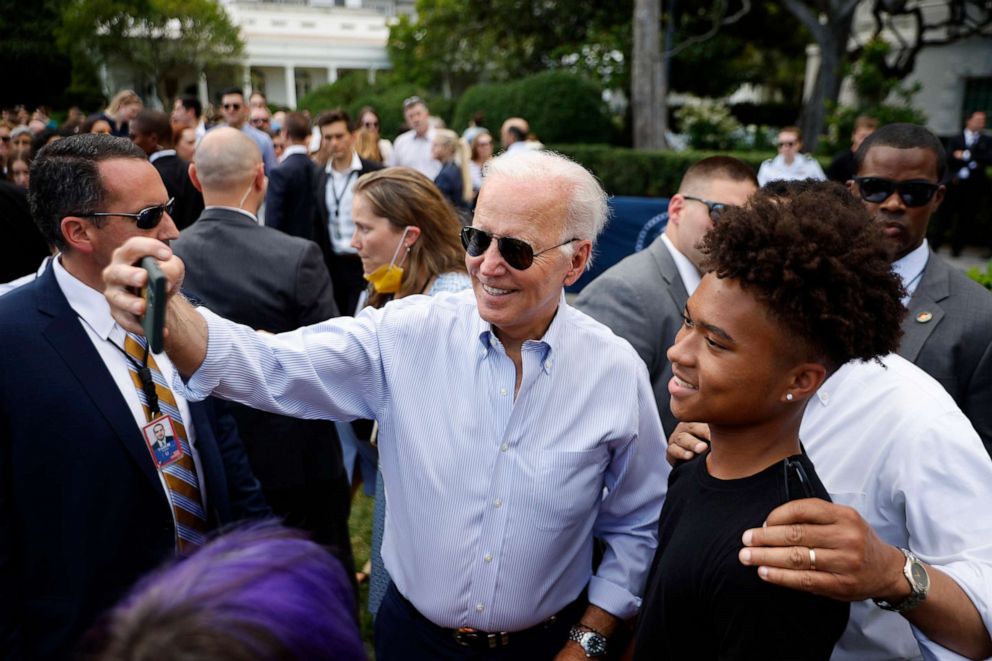 PHOTO: President Joe Biden poses for selfies during the Congressional Picnic on the South Lawn of the White House on July 12, 2022 in Washington, DC.