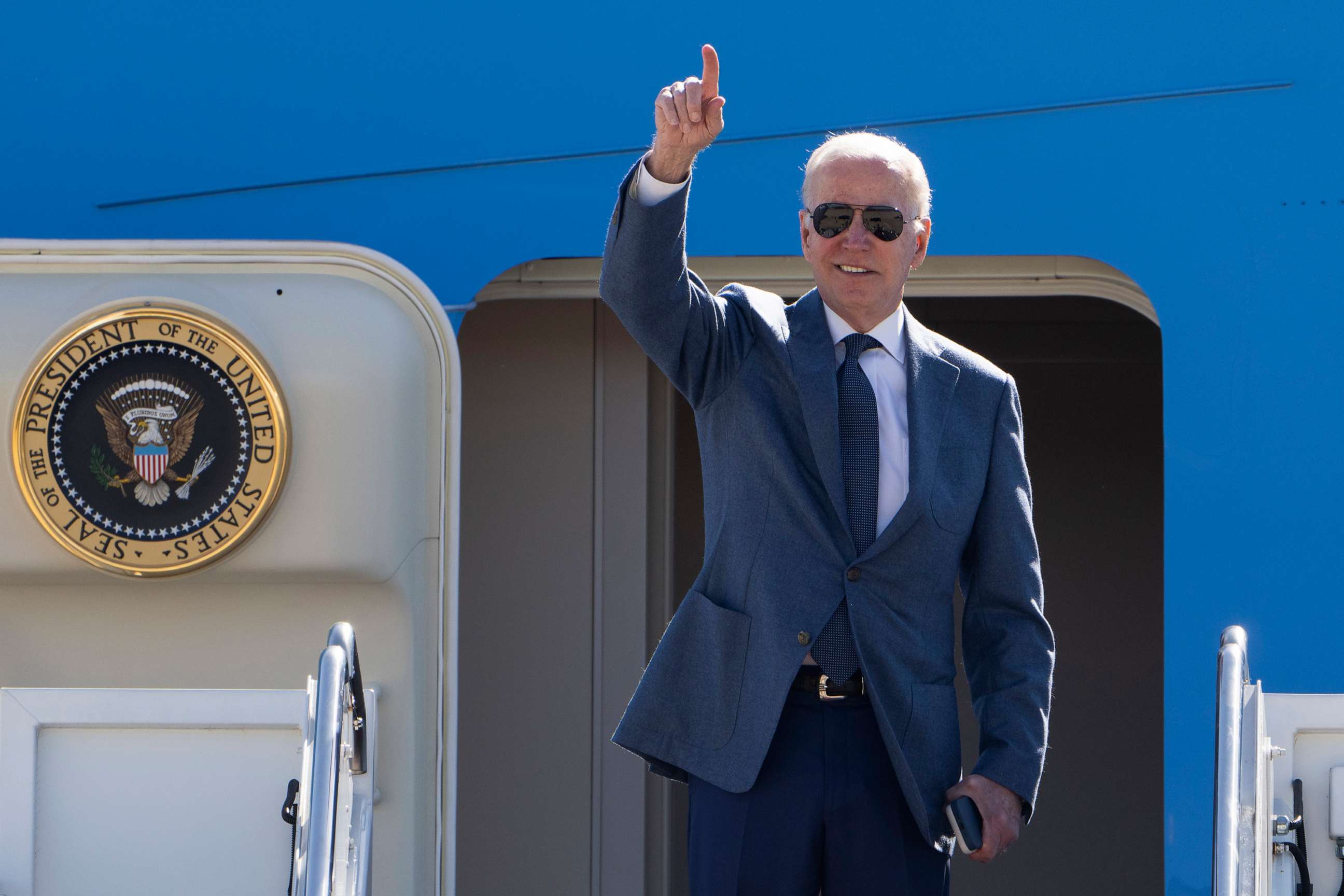 PHOTO: President Joe Biden gestures as he boards Air Force One at Andrews Air Force Base, Md., April 11, 2023.