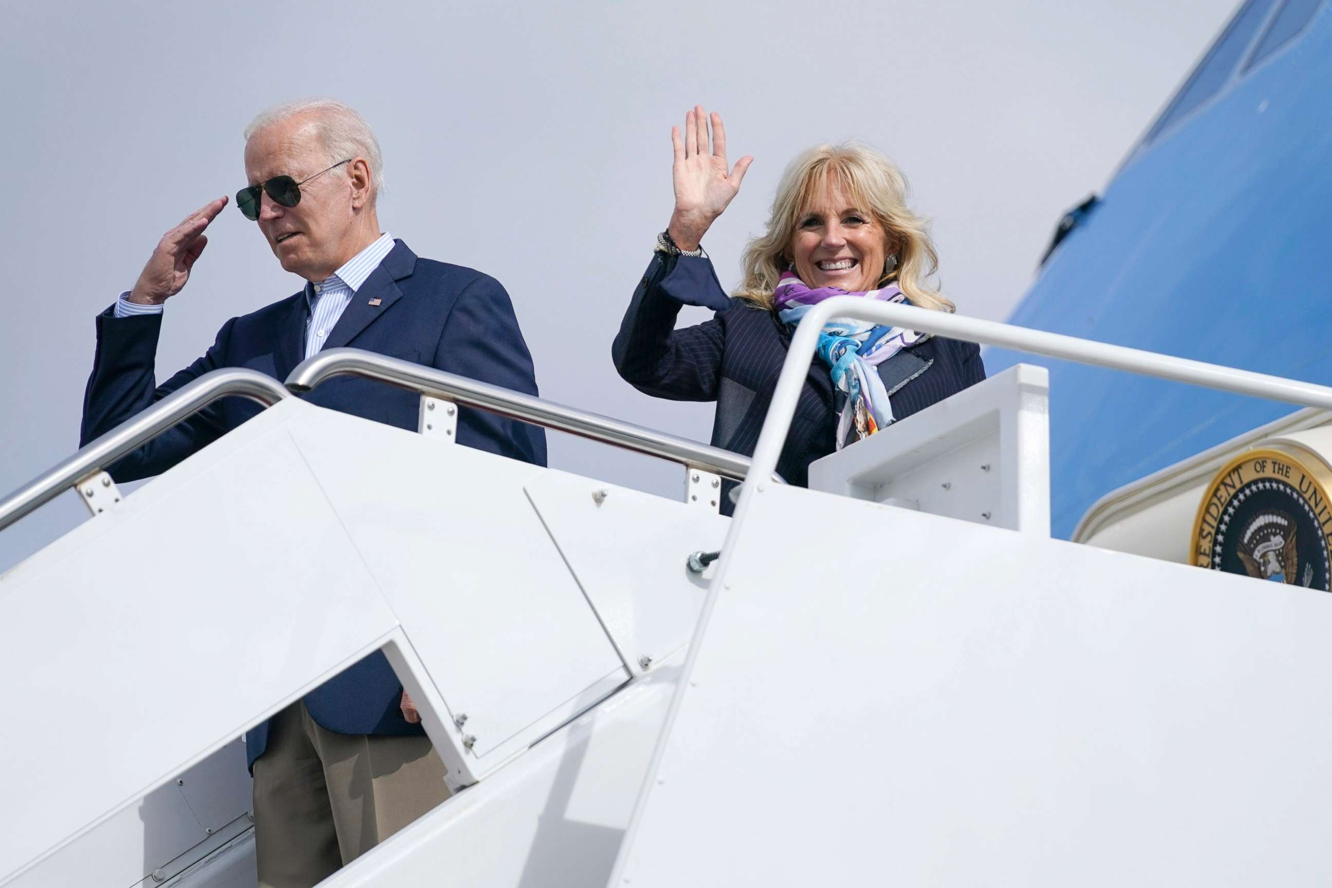 PHOTO: President Joe Biden returns a salute as he and first lady Jill Biden board Air Force One for a trip to Rome to attend the G-20 meeting, Oct. 28, 2021, in Andrews Air Force Base, Md. 
