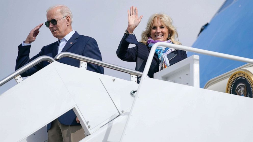 PHOTO: President Joe Biden returns a salute as he and first lady Jill Biden board Air Force One for a trip to Rome to attend the G-20 meeting, Oct. 28, 2021, in Andrews Air Force Base, Md. 