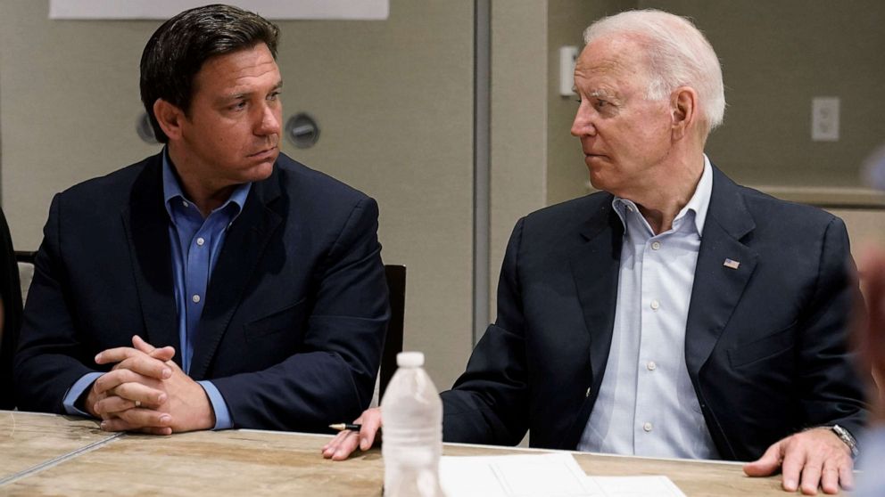 PHOTO: President Joe Biden looks at Florida Gov. Ron DeSantis during a briefing with first responders and local officials in Miami, July 1, 2021, on the condo tower that collapsed in Surfside, Fla., last week.