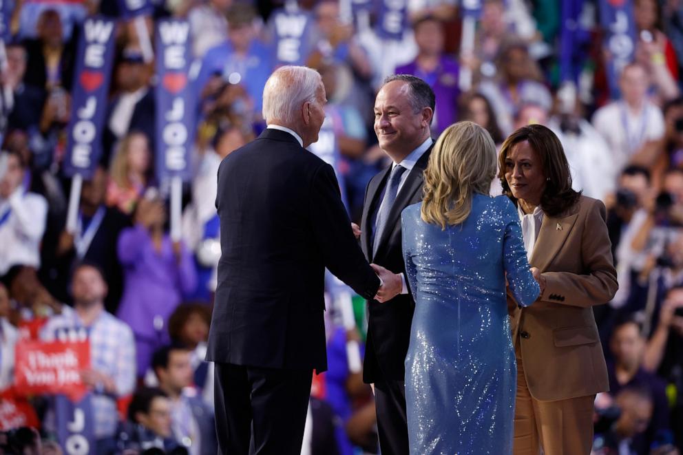 PHOTO: President Joe Biden and First Lady Jill Biden greet Second Gentleman Doug Emhoff and Vice President Kamala Harris during the first day of the Democratic National Convention at the United Center on Aug. 19, 2024 in Chicago.