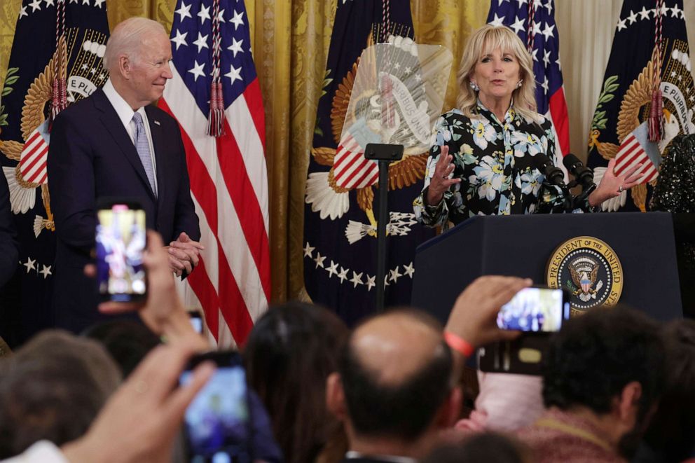 PHOTO: President Joe Biden looks on as First Lady Dr. Jill Biden speaks during an Eid al-Fitr reception at the East Room of the White House May 2, 2022 in Washington, DC.