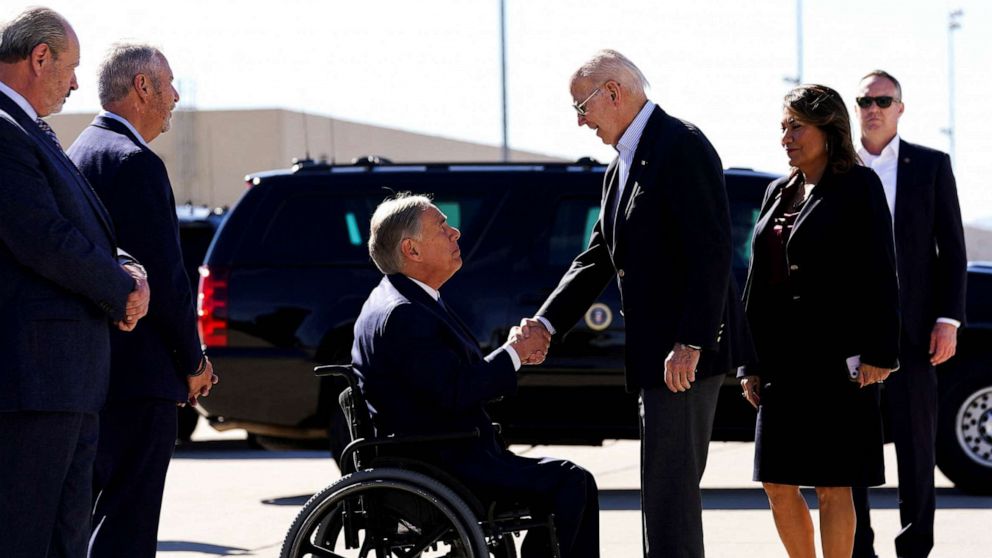 PHOTO: U.S. President Joe Biden shakes hands with Texas Governor Greg Abbott upon his arrival to the U.S.-Mexico border to assess border enforcement operations, in El Paso, Texas, Jan. 8, 2023.