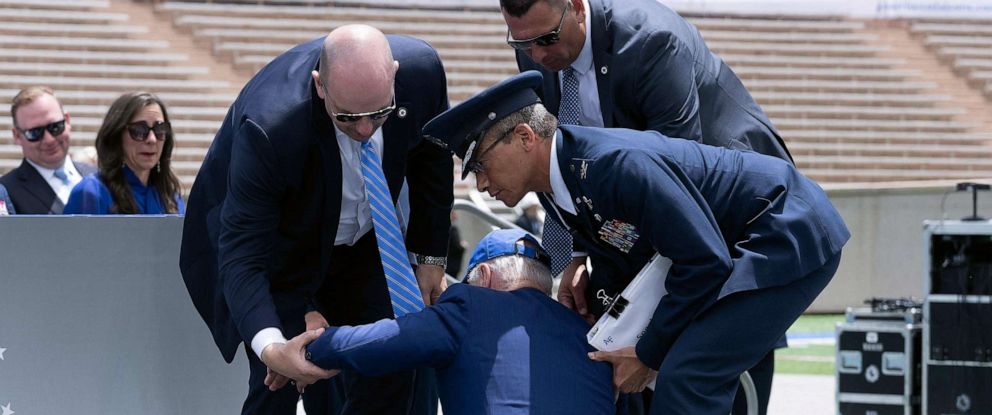 PHOTO: President Joe Biden is helped up after falling during the graduation ceremony at the United States Air Force Academy, just north of Colorado Springs in El Paso County, Colorado, June 1, 2023.