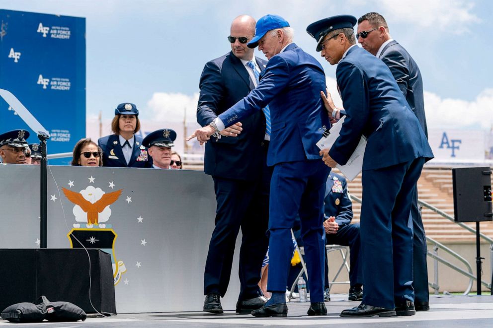 PHOTO: President Joe Biden points to sandbags after falling on stage during the 2023 United States Air Force Academy Graduation Ceremony, June 1, 2023, at the United States Air Force Academy in Colorado Springs, Colo.