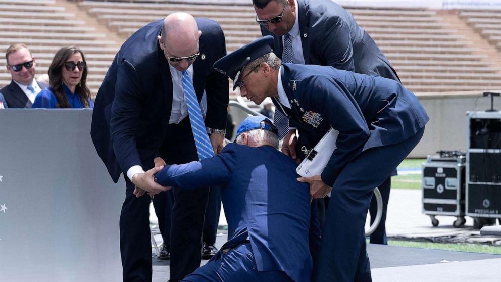 PHOTO: In this June 1, 2023, file photo, President Joe Biden is helped up after falling during the graduation ceremony at the United States Air Force Academy, just north of Colorado Springs in El Paso County, Colorado.