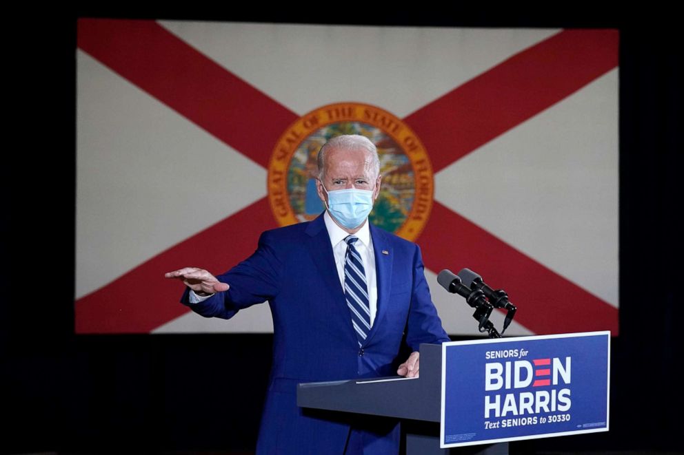 PHOTO: The Florida state flag is shown behind Democratic presidential candidate former Vice President Joe Biden as he speaks at Southwest Focal Point Community Center in, Pembroke Pines, Fla., Oct. 13, 2020.