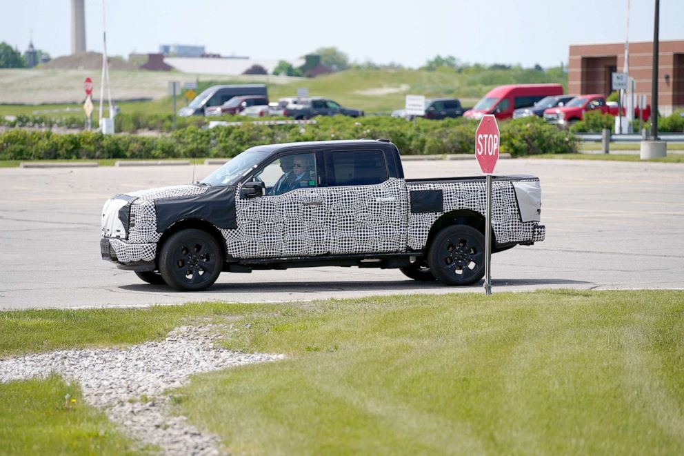 PHOTO: President Joe Biden drives a F150 Lightning electric truck at the Ford Dearborn Development Center in Dearborn, Mich., May 18, 2021.
