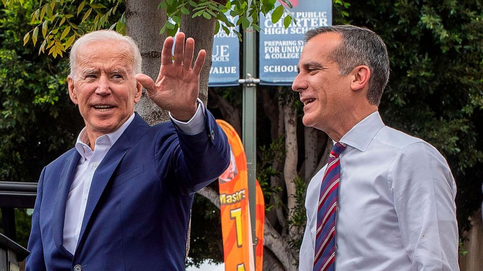 PHOTO: Democratic presidential candidate and Former vice president Joe Biden, left, appears with Los Angeles Mayor Eric Garcetti at a King Taco shop in Los Angeles on May 8, 2019. 
