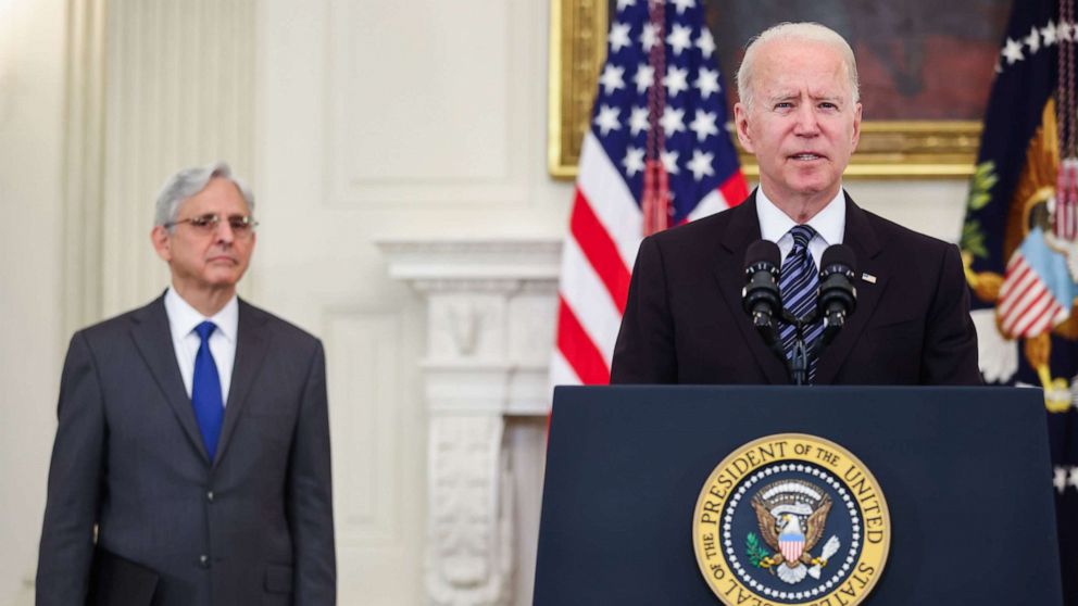 PHOTO: US Attorney General Merrick Garland looks on as President Joe Biden speaks during an event on the Administration's gun crime prevention strategy in the State Dining Room of the White House in Washington, D.C., June 23, 2021.
