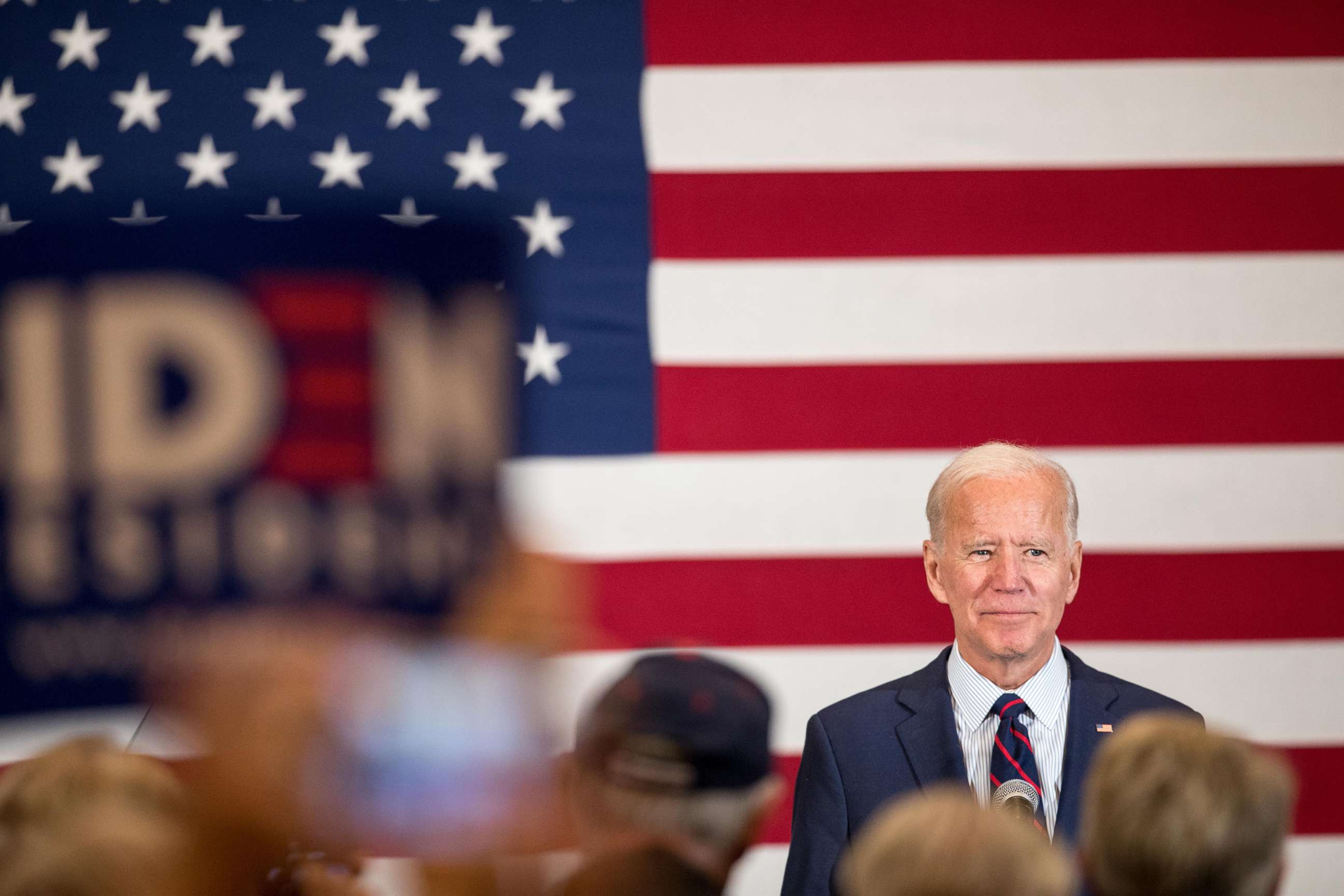 PHOTO: Democratic presidential candidate, former Vice President Joe Biden stands on stage while the crowd applauds during a campaign event on Oct. 9, 2019 in Manchester, N.H.