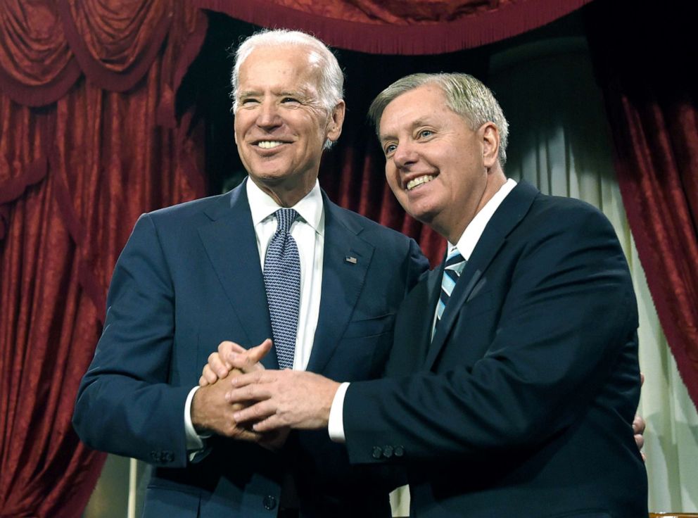 PHOTO: Vice President Joe Biden shares a laugh with Sen. Lindsey Graham, R-S.C. before Biden administered the Senate oath during a ceremonial re-enactment swearing-in ceremony, Jan. 6, 2015, on Capitol Hill.