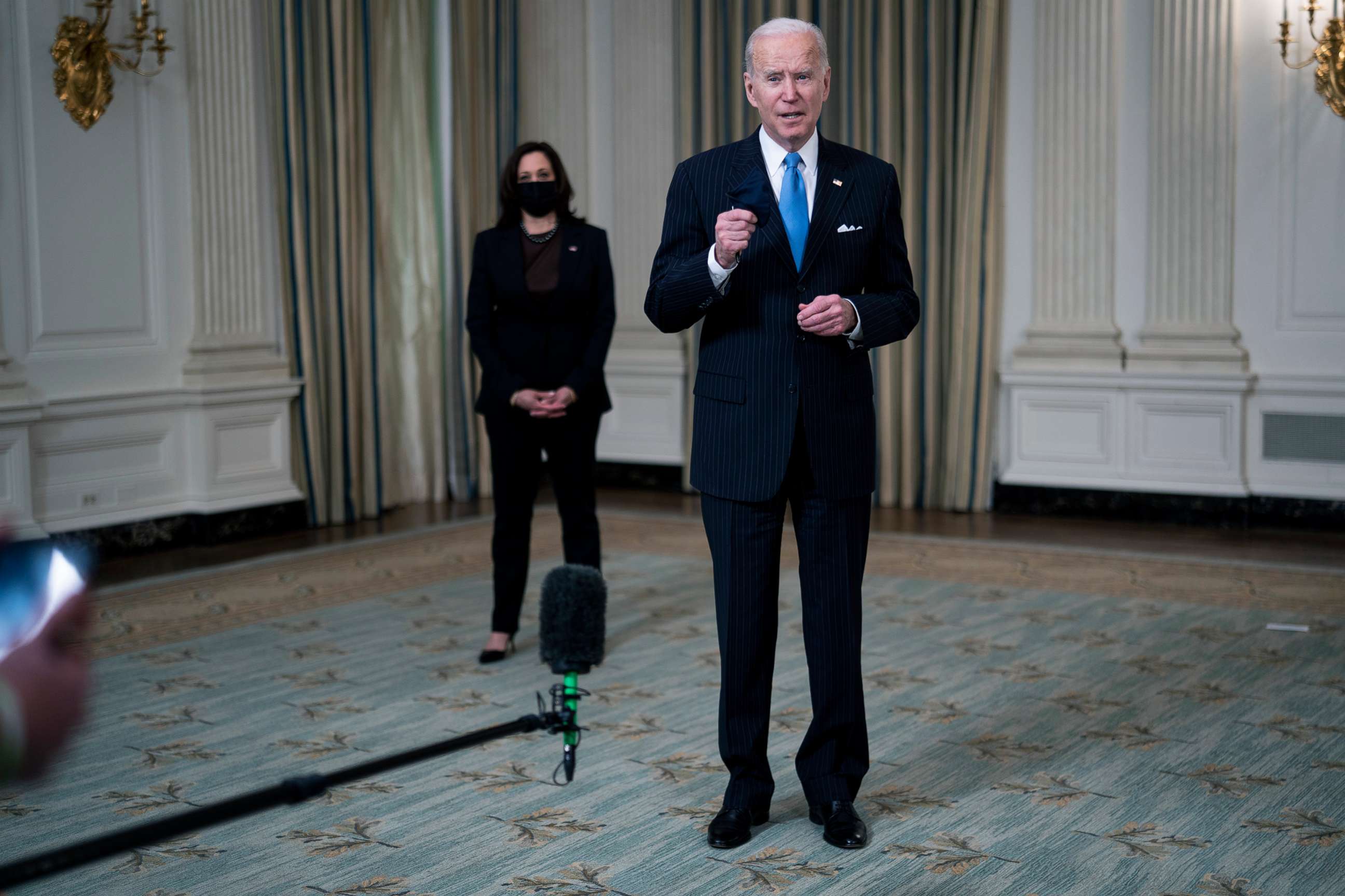 PHOTO: President Joe Biden briefly speaks to reporters after delivering remarks in the State Dining Room of the White House, March 2, 2021,