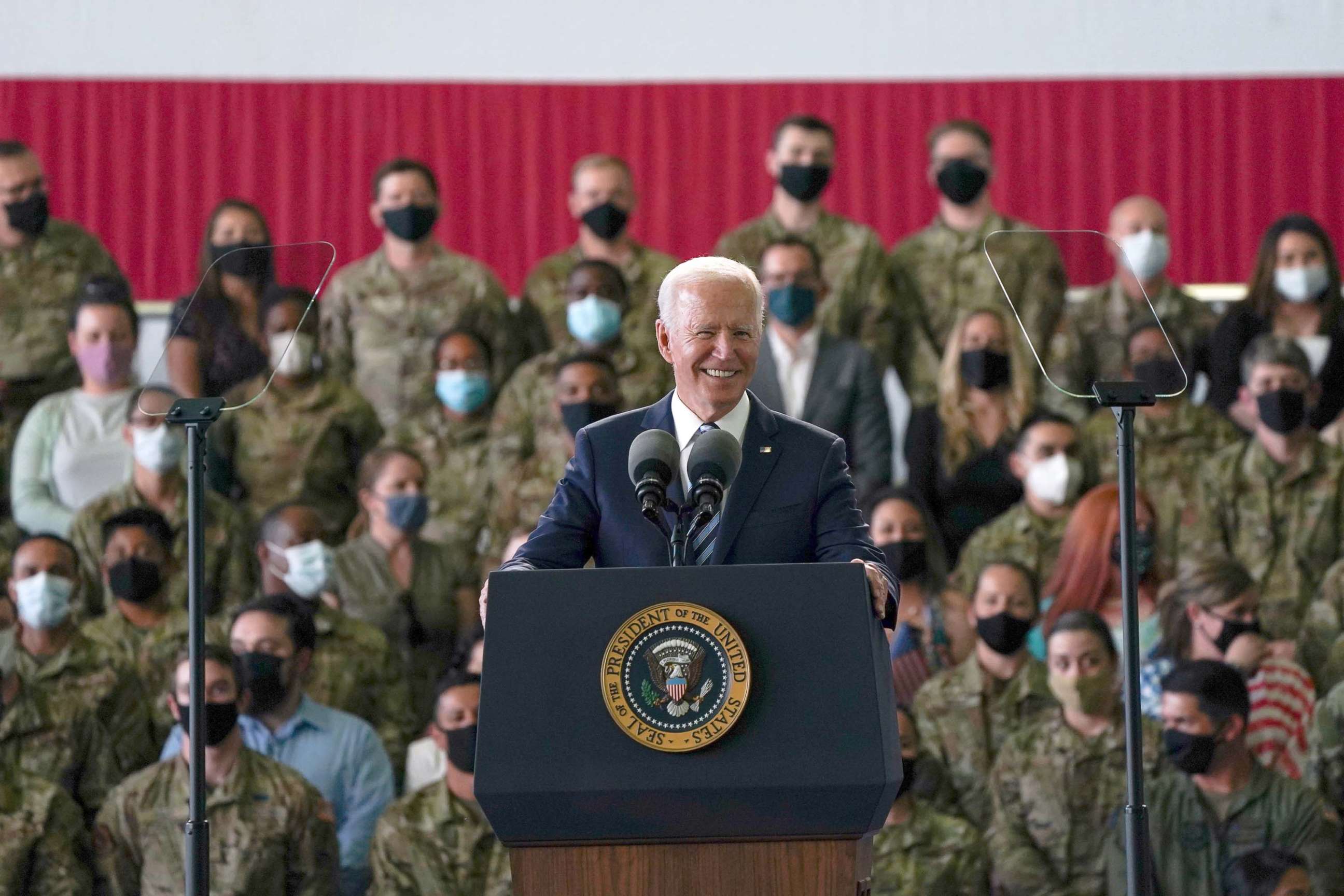 PHOTO: President Joe Biden addresses US Air Force personnel at RAF Mildenhall in Suffolk, ahead of the G7 summit in Cornwall, June 9, 2021 in Mildenhall, England.