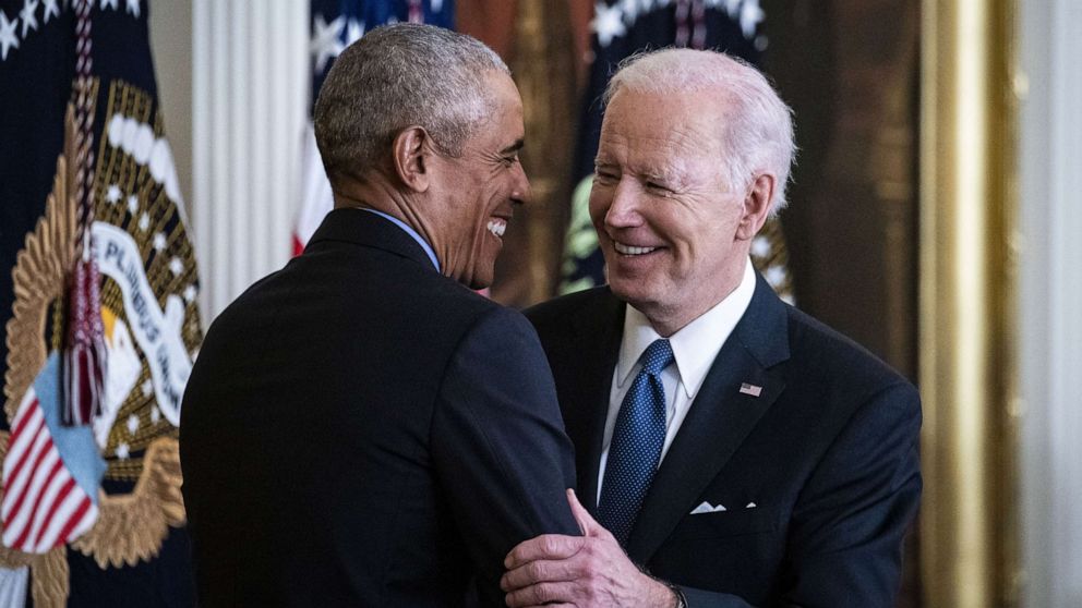 PHOTO: President Joe Biden and former President Barack Obama, left, embrace during an event on the Affordable Care Act and lowering health care costs for families in the East Room of the White House, April 5, 2022. 