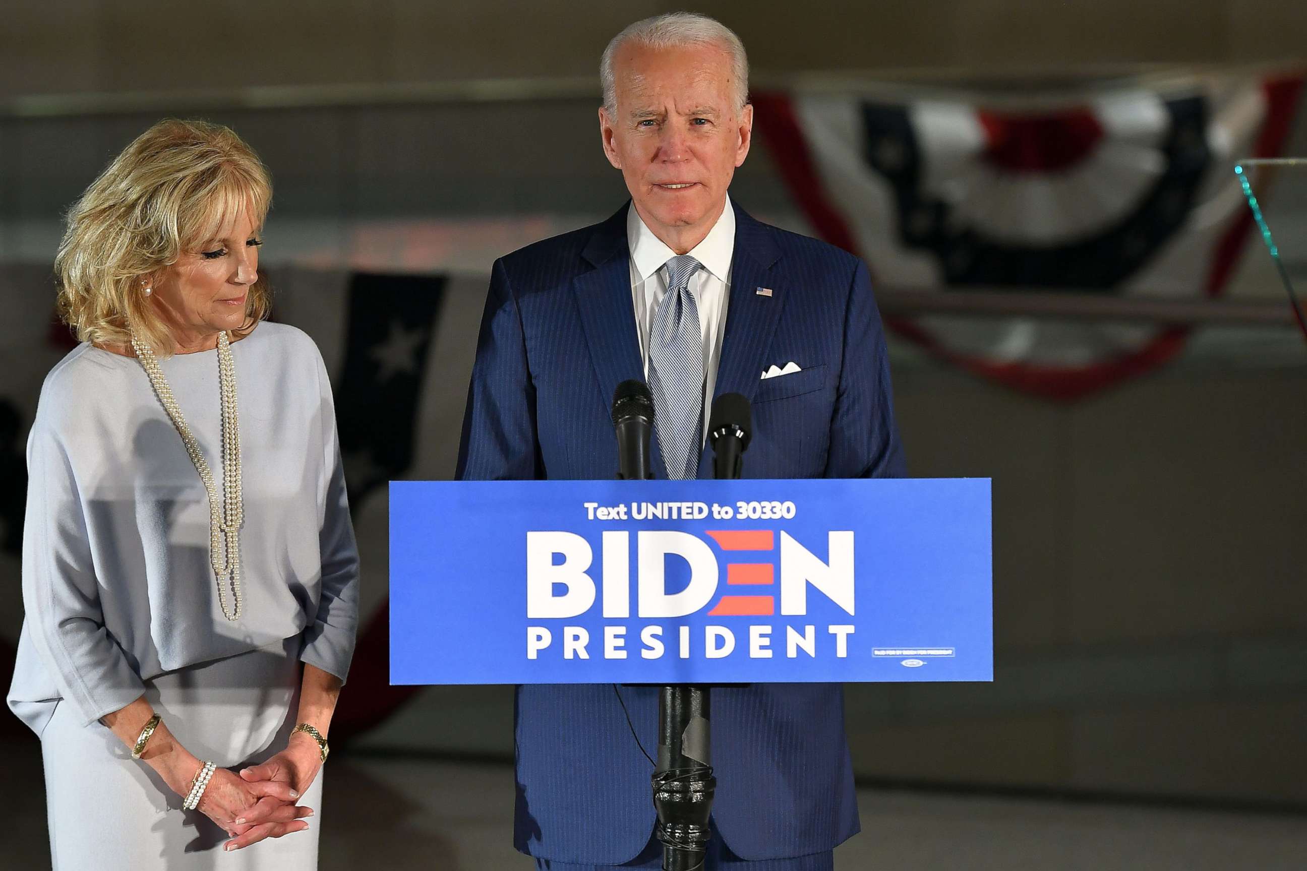 PHOTO: Democratic presidential hopeful former Vice President Joe Biden speaks, flanked by his wife Jill Biden, at the National Constitution Center in Philadelphia, on March 10, 2020.