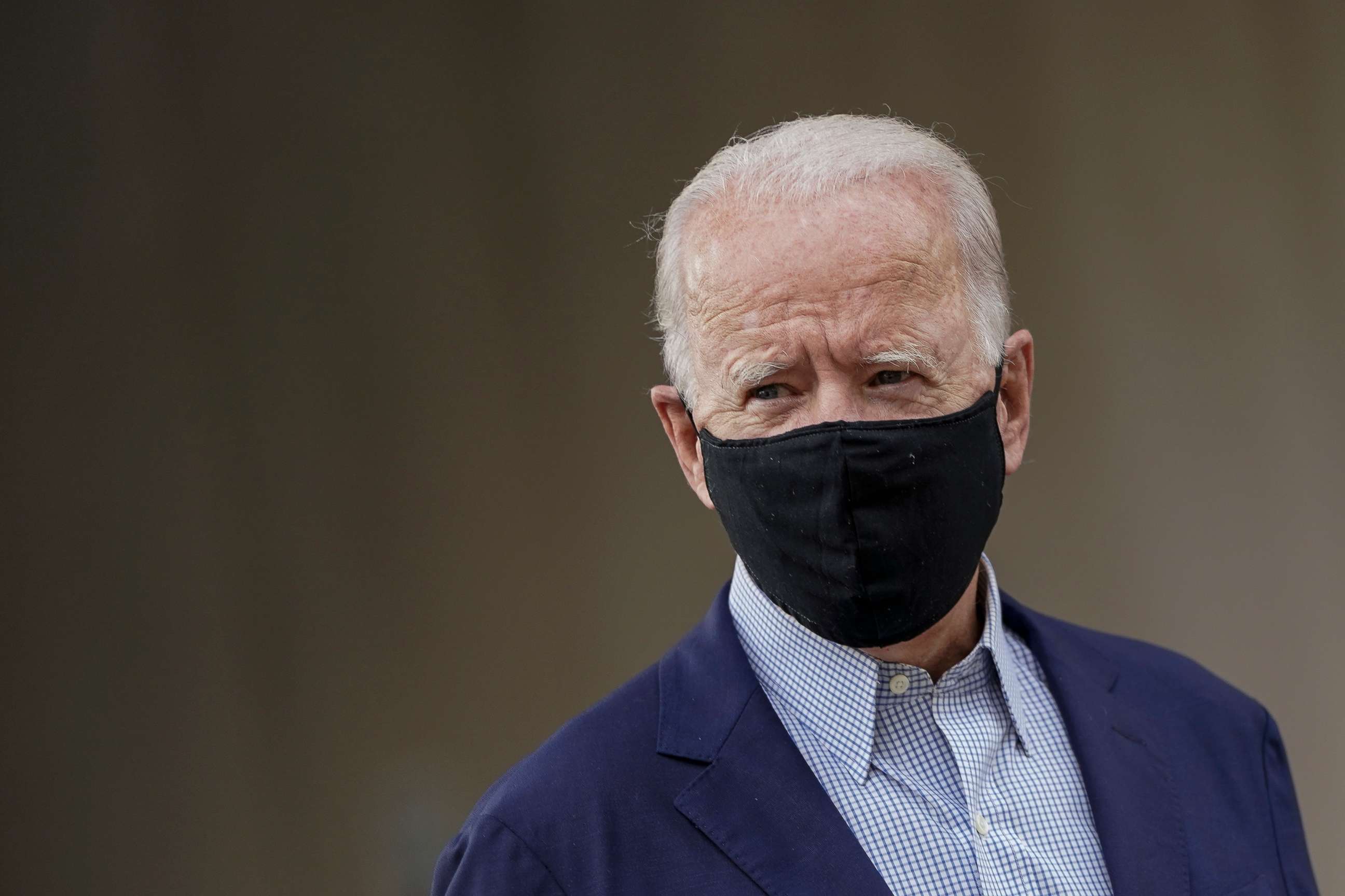 PHOTO: Democratic presidential nominee Joe Biden departs the Delaware State Building after early voting in the state's primary election on Sept. 14, 2020 in Wilmington, Del.