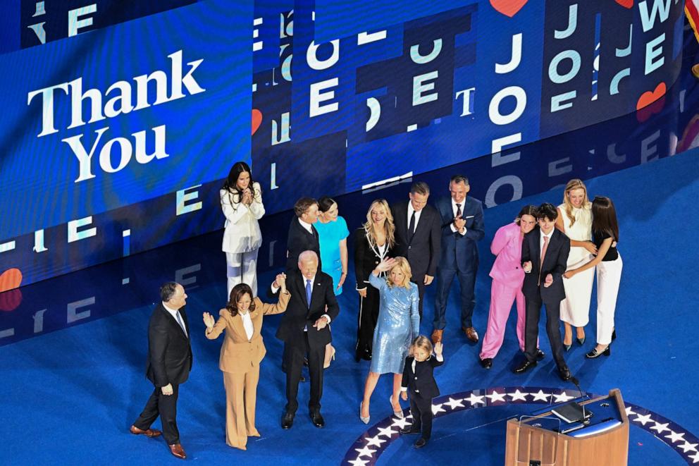 PHOTO: US President Joe Biden raises hands with US Vice President and 2024 Democratic presidential candidate Kamala Harris at the United Center in Chicago, Aug. 19, 2024. 