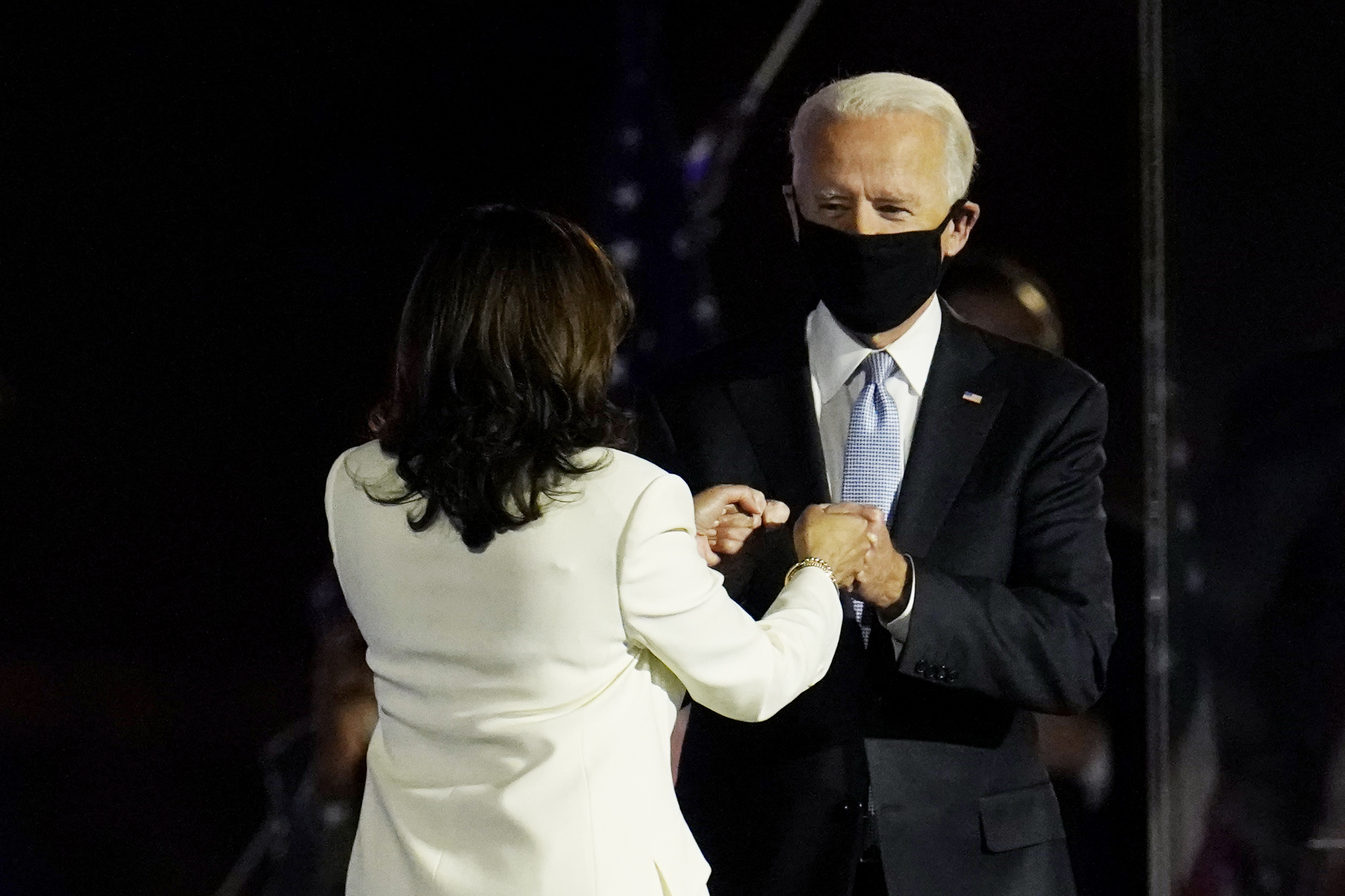 PHOTO: President-elect Joe Biden is greeted on stage by Vice President-elect Kamala Harris before he speaks in Wilmington, Del., Saturday, Nov. 7, 2020.