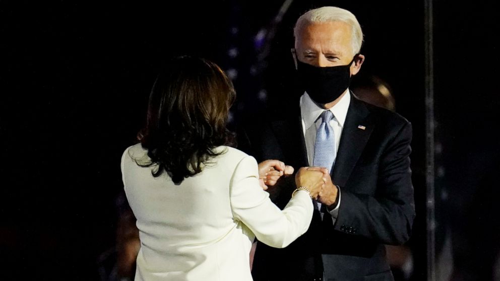 PHOTO: President-elect Joe Biden is greeted on stage by Vice President-elect Kamala Harris before he speaks in Wilmington, Del., Saturday, Nov. 7, 2020.