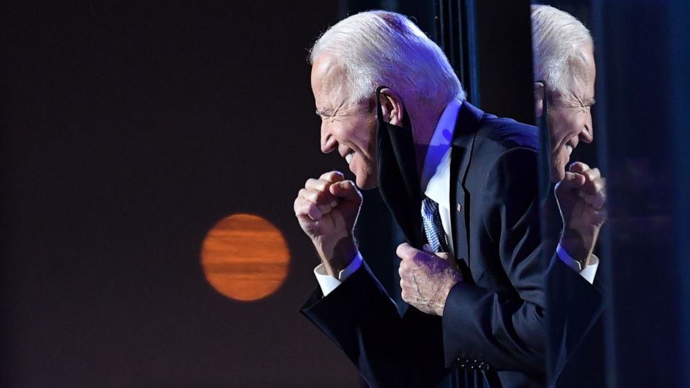 PHOTO: President-elect Joe Biden gestures to the crowd after he delivered remarks in Wilmington, Del., Nov. 7, 2020.