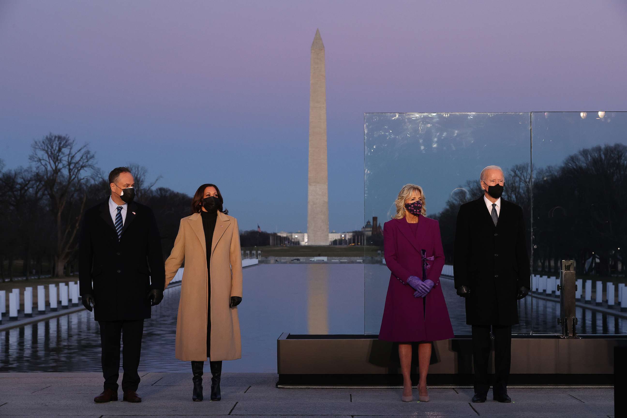 Douglas Emhoff,Vice President-elect Kamala Harris,Jill Biden and President-elect Joe Biden attend a memorial service honoring nearly 400,000 American victims of the COVID-19 pandemic at the Lincoln Memorial Reflecting Pool,Jan. 19, 2021, in Washington.