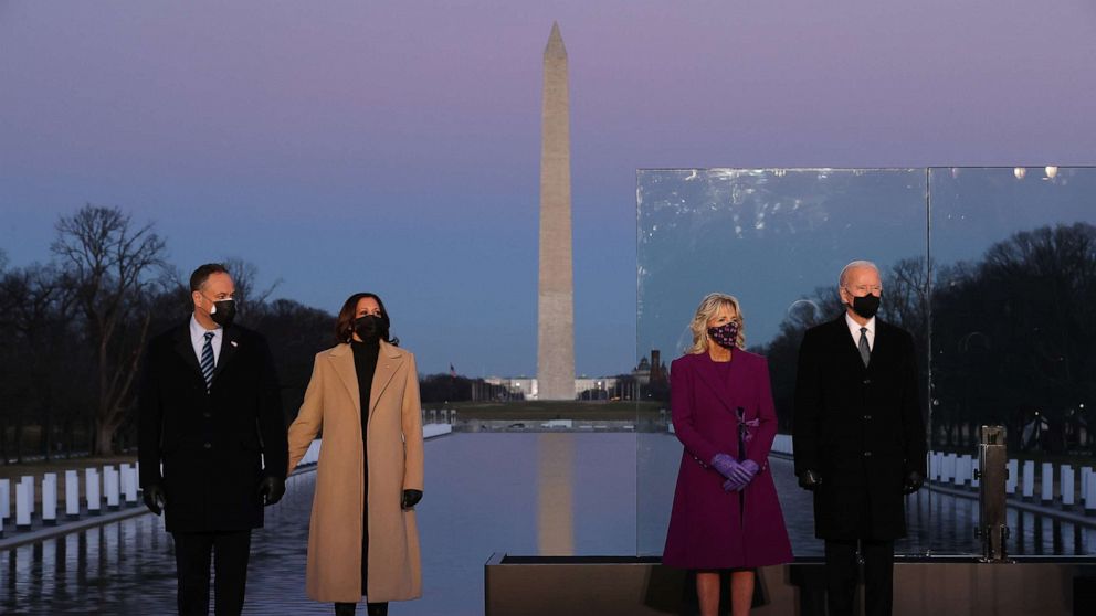 Douglas Emhoff,Vice President-elect Kamala Harris,Jill Biden and President-elect Joe Biden attend a memorial service honoring nearly 400,000 American victims of the COVID-19 pandemic at the Lincoln Memorial Reflecting Pool,Jan. 19, 2021, in Washington.