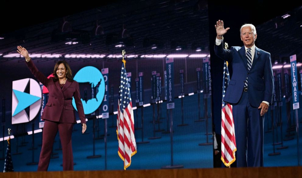 PHOTO: Sen. Kamala Harris and former Vice President Joe Biden wave from the stage at the end of the third day of the Democratic National Convention, in Wilmington, Del., Aug. 19, 2020.