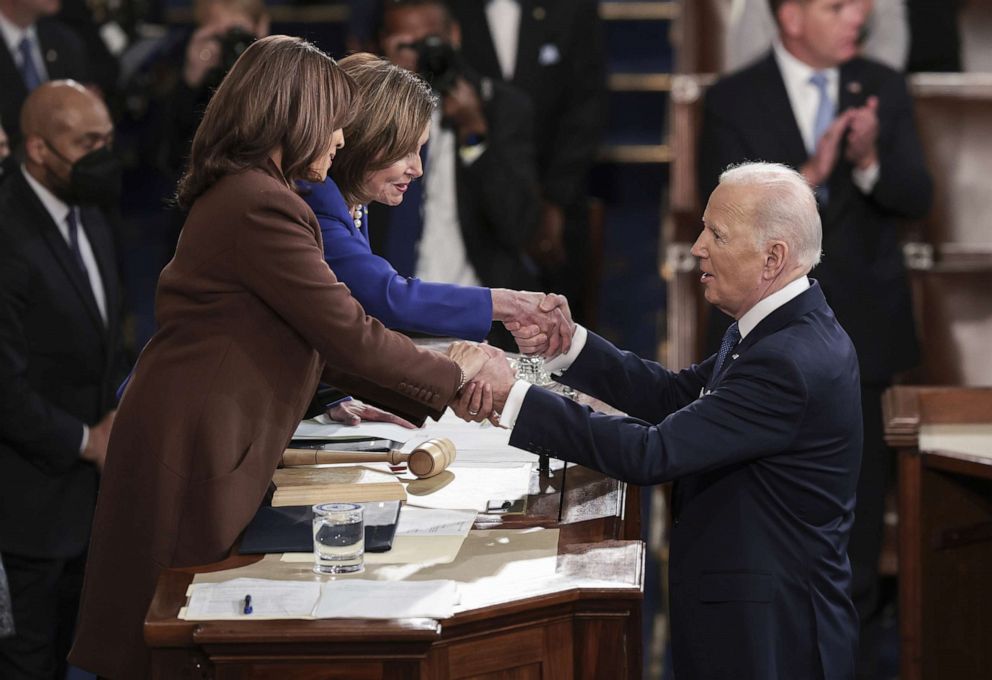 PHOTO: President Joe Biden holds hands with Vice President Kamala Harris and Speaker of the House Nancy Pelosi after delivering the State of the Union address in the US Capitol's House Chamber, in Washington, D.C., March 1, 2022.