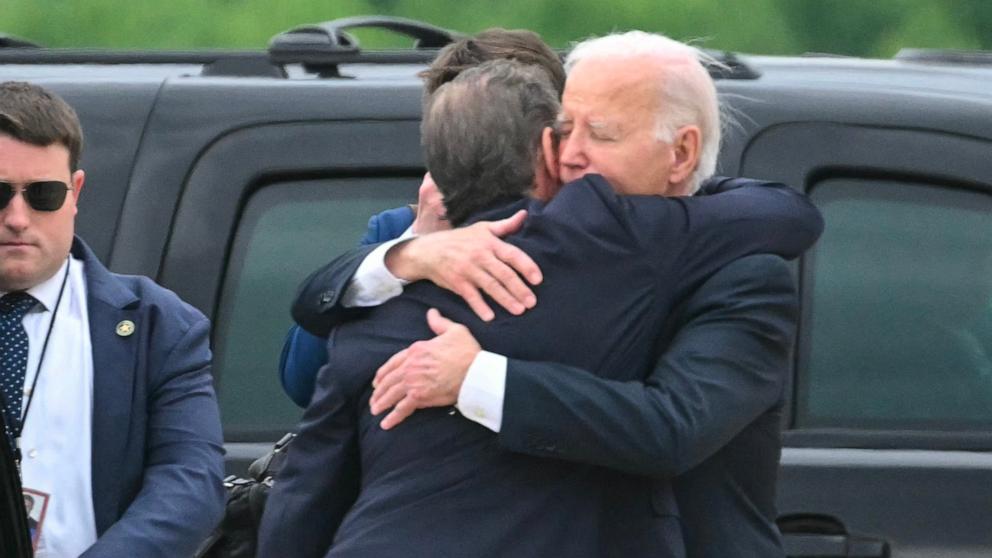 PHOTO: President Joe Biden hugs his son Hunter Biden upon arrival at Delaware Air National Guard Base in New Castle, Del., on June 11, 2024, as he travels to Wilmington, Del. 