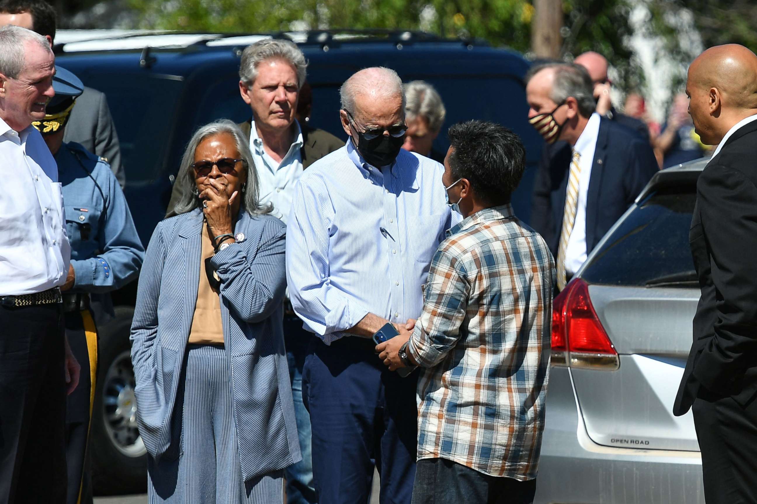 PHOTO: President Joe Biden greets a resident as he tours a neighborhood affected by Hurricane Ida in Manville, New Jersey, Sept. 7, 2021.