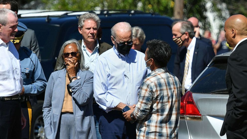 PHOTO: President Joe Biden greets a resident as he tours a neighborhood affected by Hurricane Ida in Manville, New Jersey, Sept. 7, 2021.