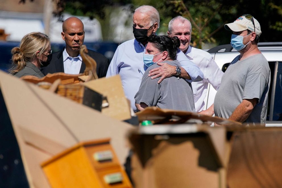 PHOTO: President Joe Biden hugs a person as he tours a neighborhood impacted by Hurricane Ida, Sept. 7, 2021, in Manville, N.J. 