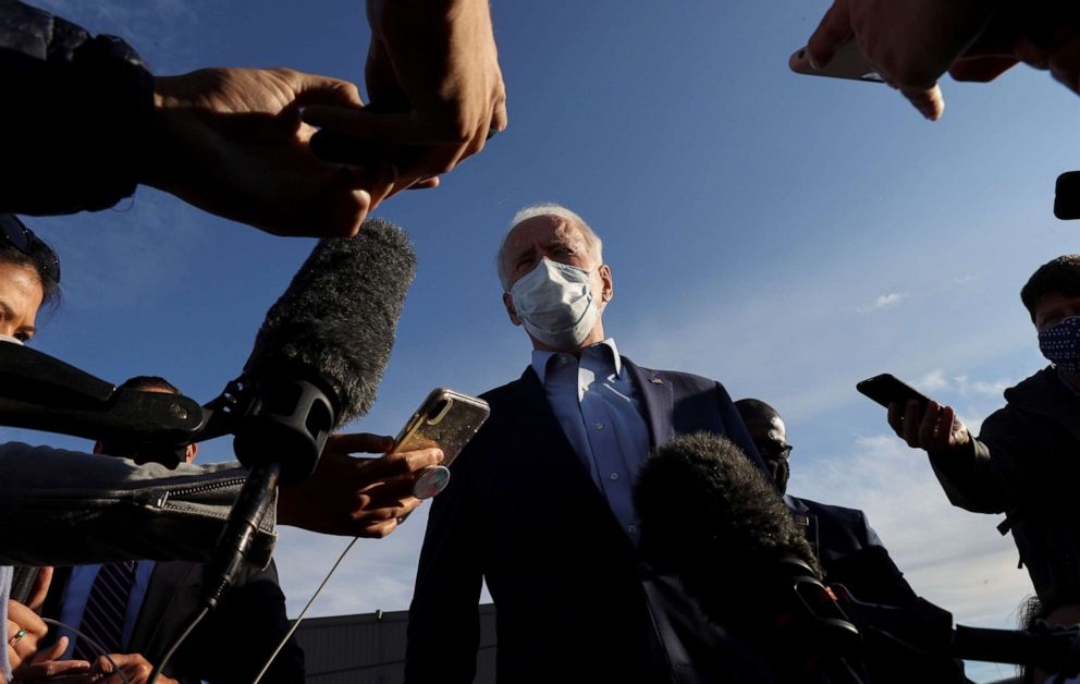 PHOTO: Democratic presidential nominee and former Vice President Joe Biden talks to reporters on the Duluth Airport tarmac before departing after campaign events in Duluth, Minn., on Sept. 18, 2020. 