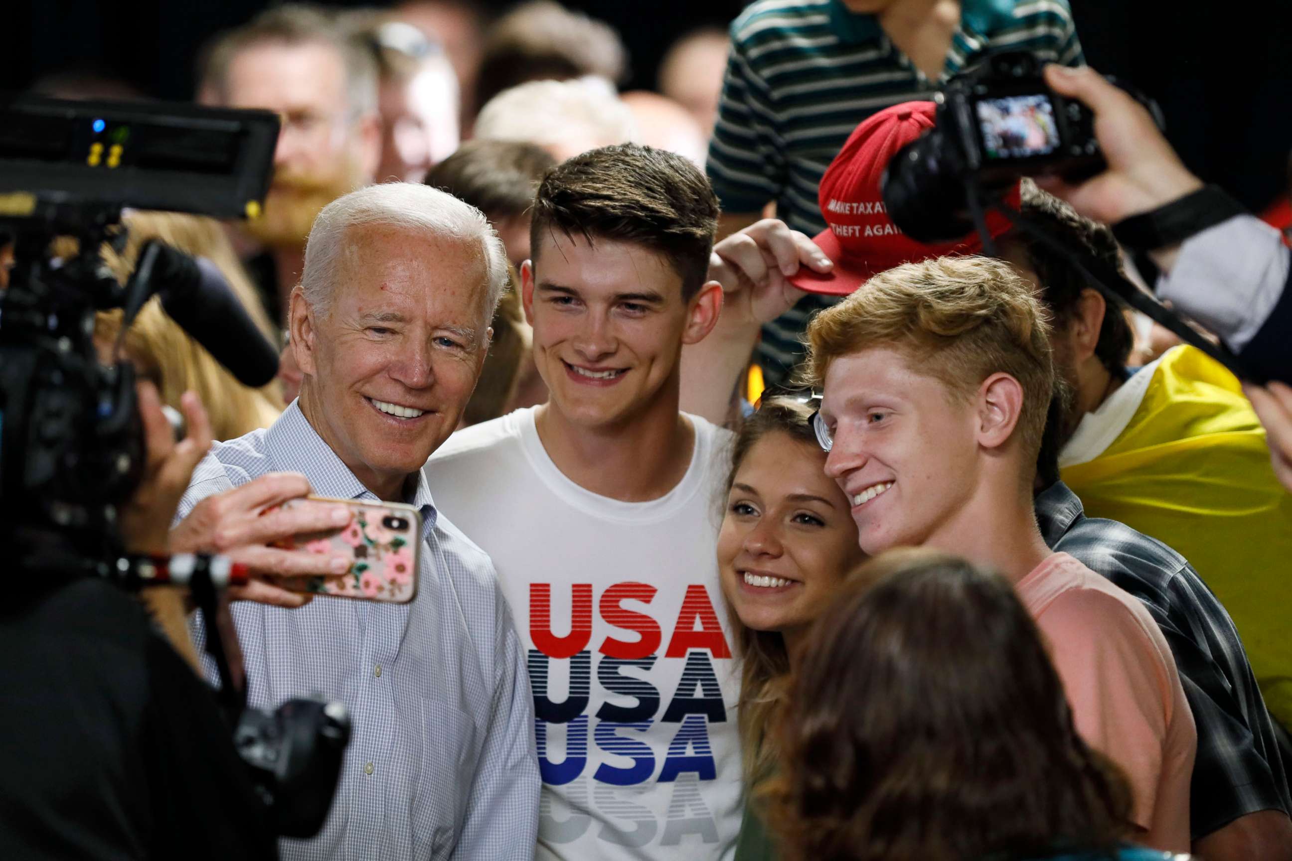 PHOTO: Democratic presidential candidate and former Vice President Joe Biden poses for a photo with audience members during a community event, July 17, 2019, in Council Bluffs, Iowa.