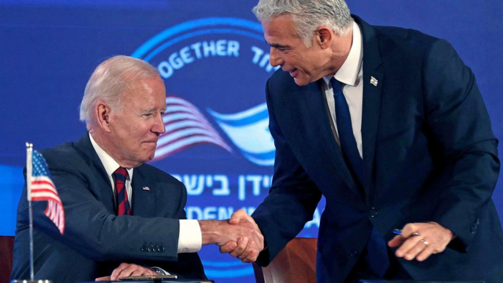PHOTO: President Joe Biden and Israel's caretaker Prime Minister Yair Lapid, shake hands before signing a security pledge in Jerusalem, on July 14, 2022. 