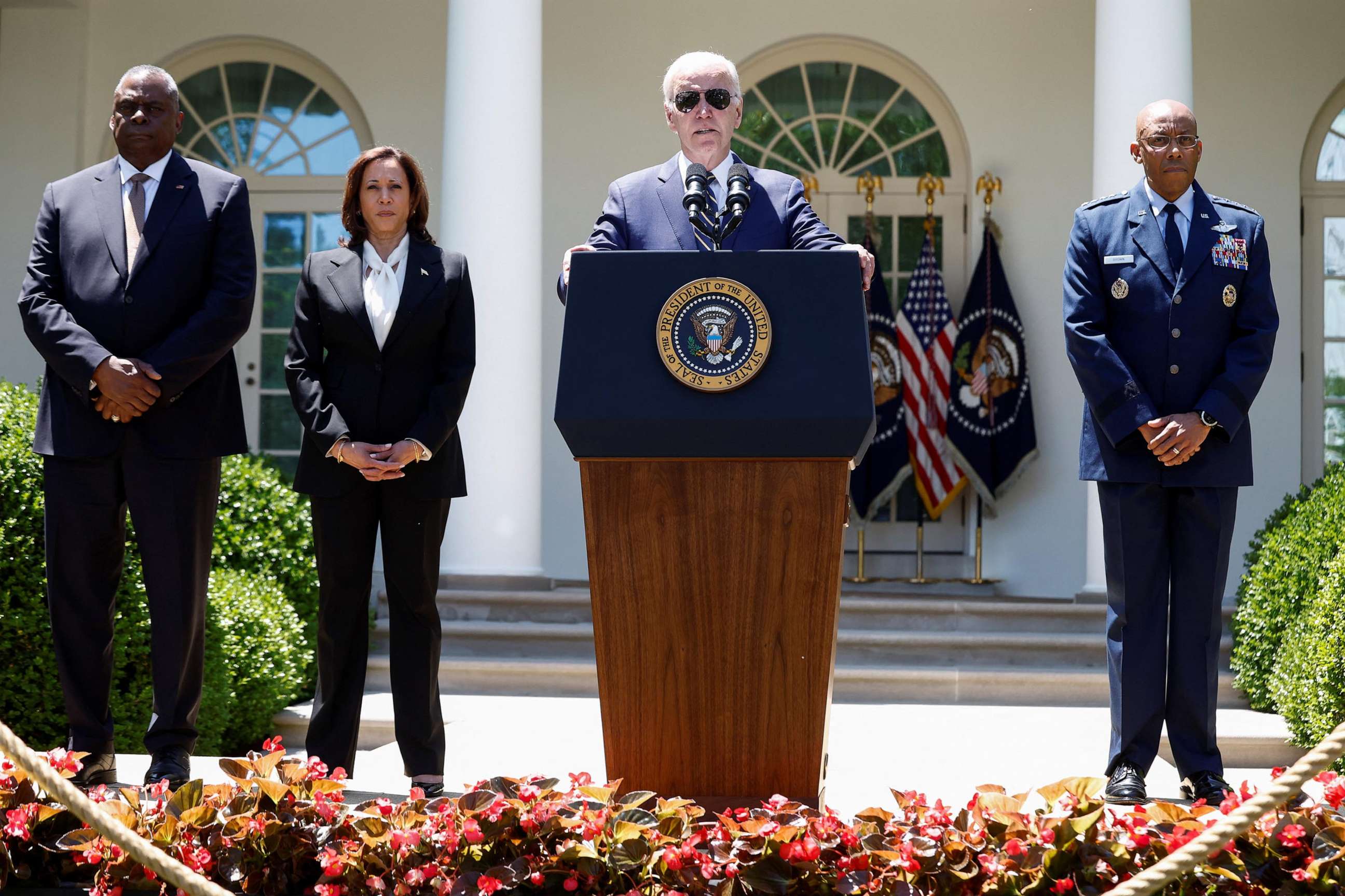 PHOTO: President Joe Biden is flanked by U.S. Defense Secretary Lloyd Austin, Vice President Kamala Harris and Air Force Gen. Charles Brown, Jr., during an event in the Rose Garden at the White House in Washington, D.C.., May 25, 2023.