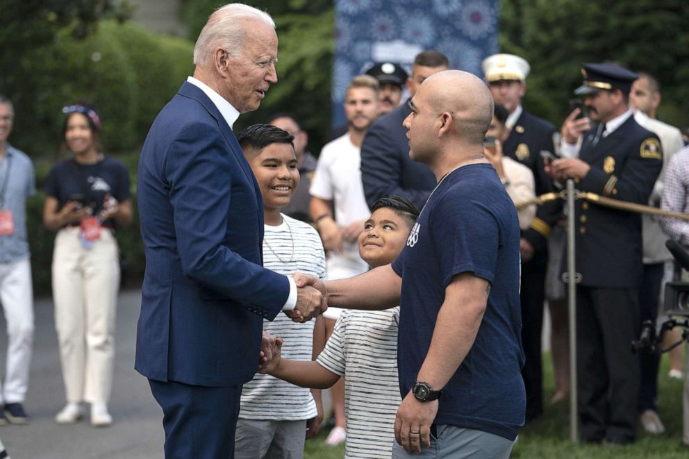 PHOTO: President Joe Biden greets essential workers, military families and administration staff members who were invited to a Fourth of July event on the South Lawn of the White House in Washington, D.C., July 4, 2021.