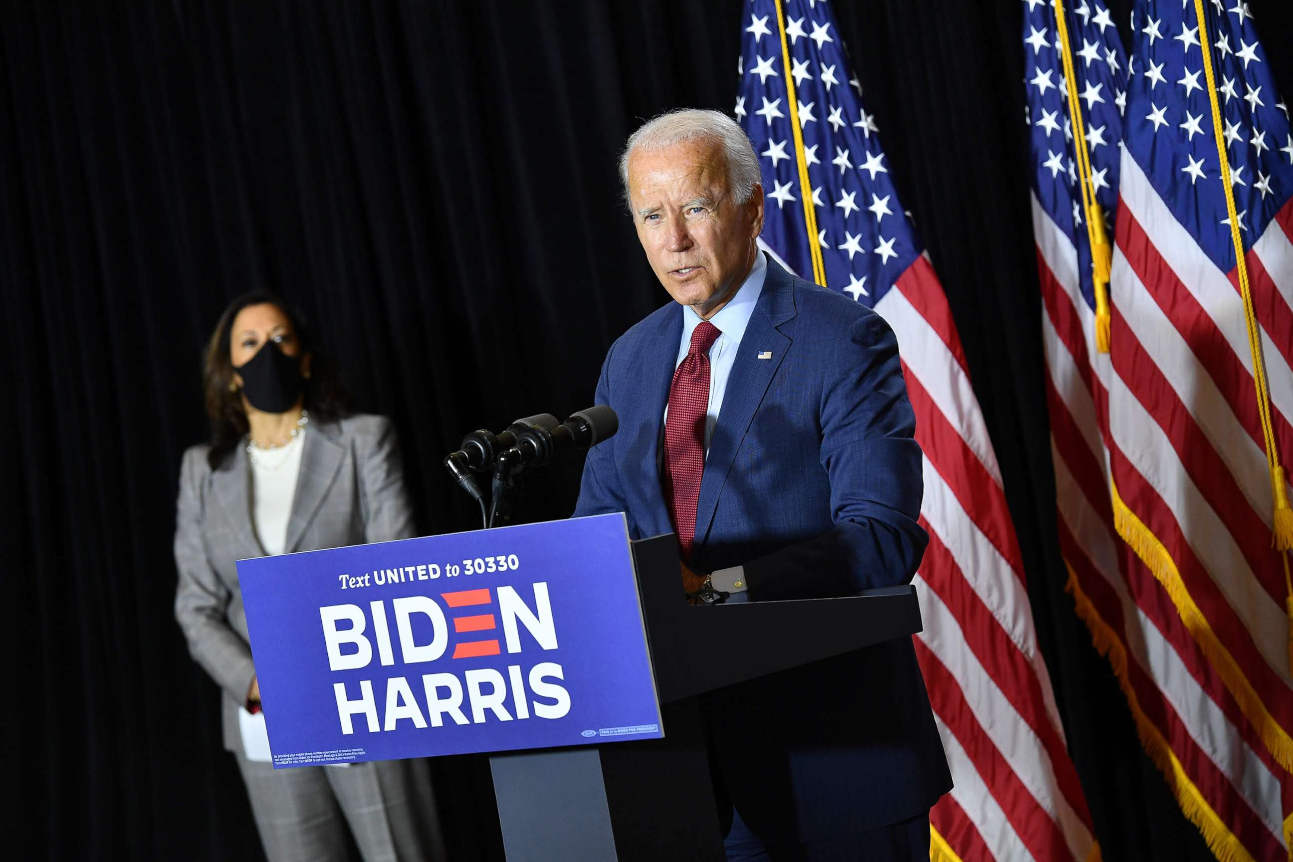 PHOTO: Democratic presidential nominee, former Vice President Joe Biden (R), and vice presidential running mate, US Senator Kamala Harris, hold a press conference after receiving a briefing on COVID-19 in Wilmington, Del., Aug. 13, 2020. 