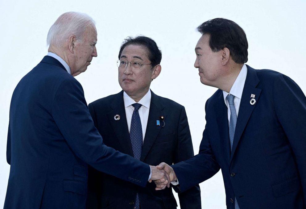 PHOTO: President Joe Biden, Japan's Prime Minister Fumio Kishida, and South Korea's President Yoon Suk Yeol greet each other ahead of a trilateral meeting during the G7 Leaders' Summit in Hiroshima on May 21, 2023.