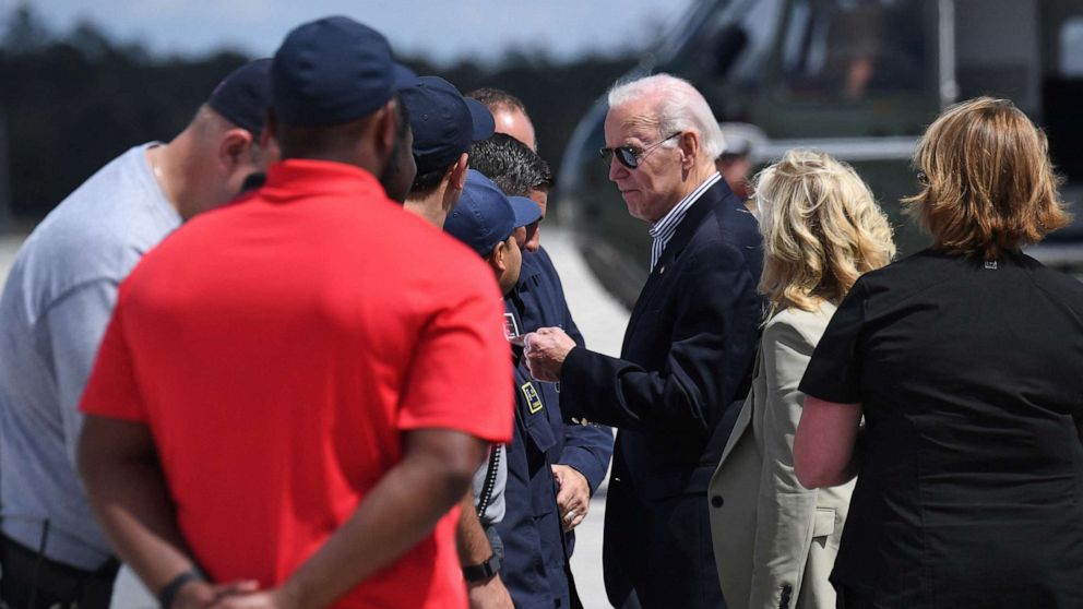 PHOTO: President Joe Biden and First Lady Jill Biden are greeted upon arrival at Southwest Florida International Airport in Fort Myers, Fla., Oct. 5, 2022, to survey the storm ravaged areas and meet with small business owners and state officials.