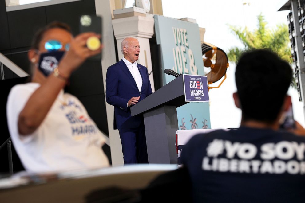 PHOTO: Democratic presidential nominee Joe Biden addresses supporters during a drive-in voter mobilization event in Miramar, Fla., Oct. 13, 2020.
