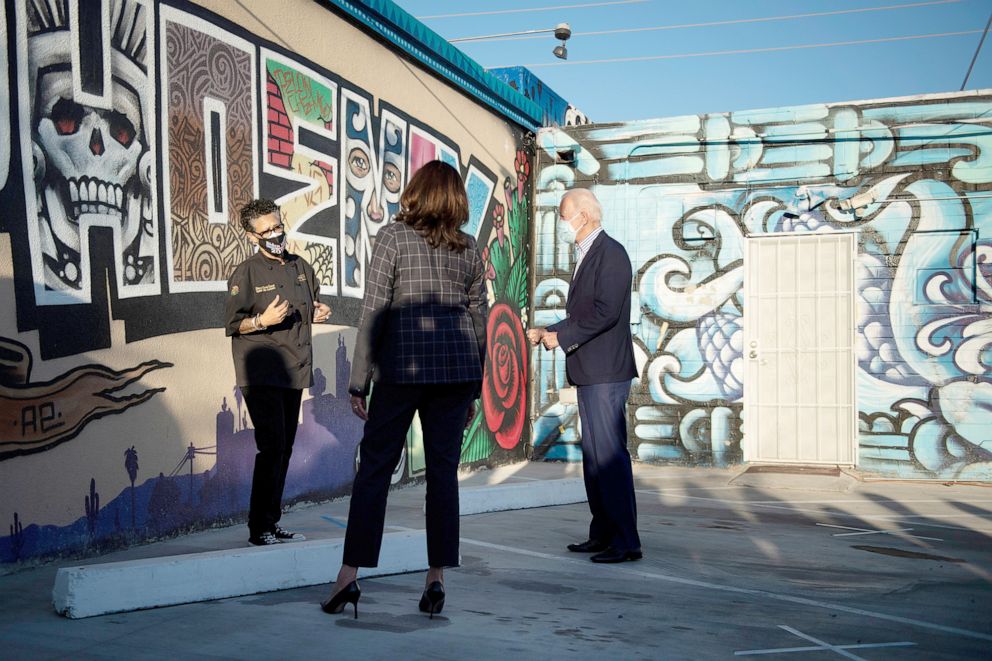 PHOTO: Owner chef Silvana Salcido Esparza speaks with US Democratic vice presidential nominee Kamala Harris and Democratic presidential candidate former US Vice President Joe Biden outside Barrio Cafe October 8, 2020, in Phoenix, Ariz., Oct. 8, 2020.